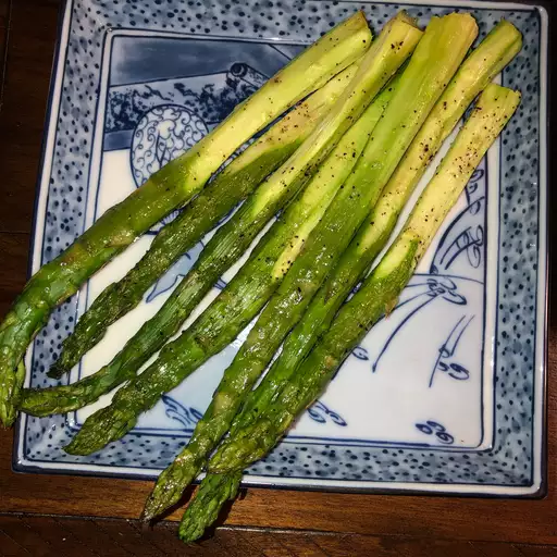 grilled asparagus on platter